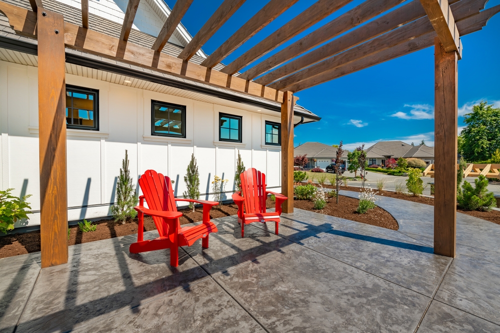 Bright,and,sunny,patio,with,pergola,stamped,concrete,with,two